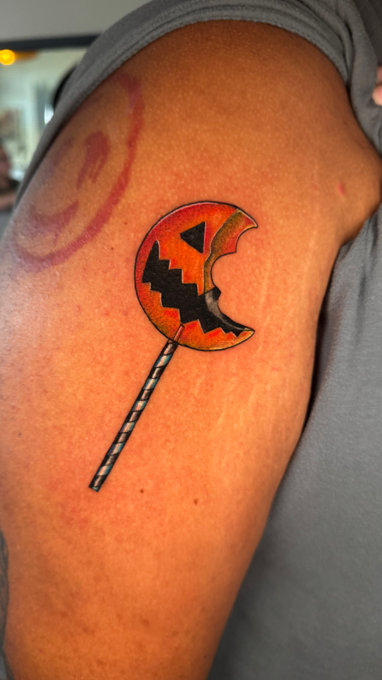Halloween pumpkin lollipop tattoo