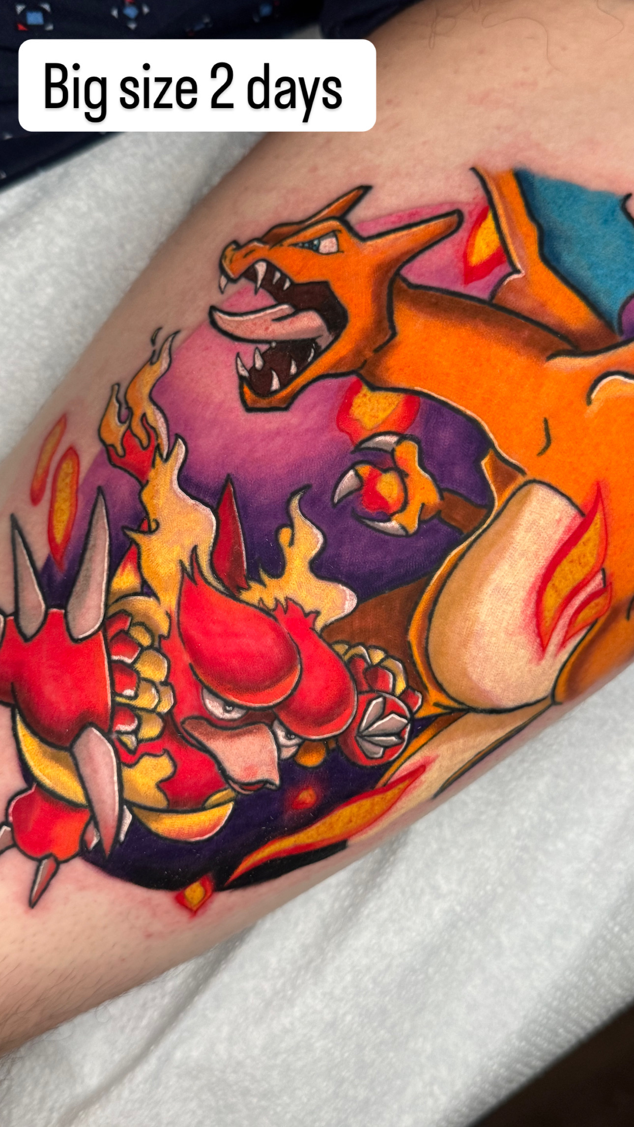 Colorful Pokémon Charizard battle scene tattoo