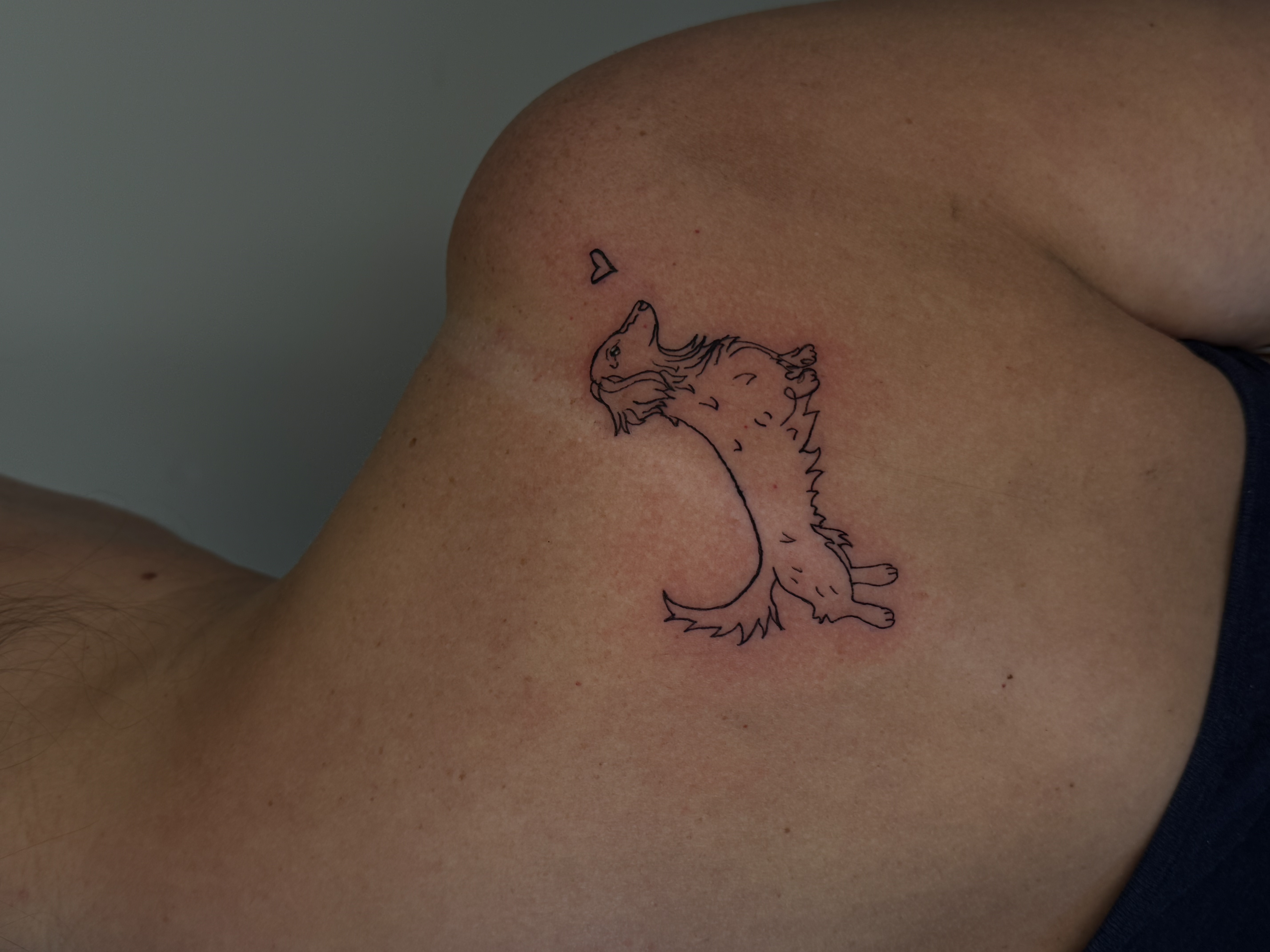 Minimalist line art dachshund dog with heart tattoo